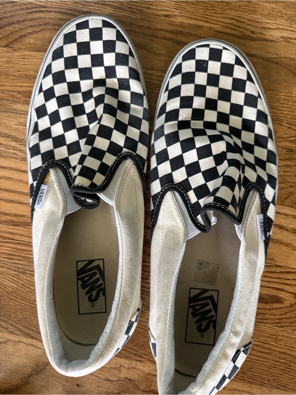 Vans Black and White Checkerboard Slip-On Sneakers